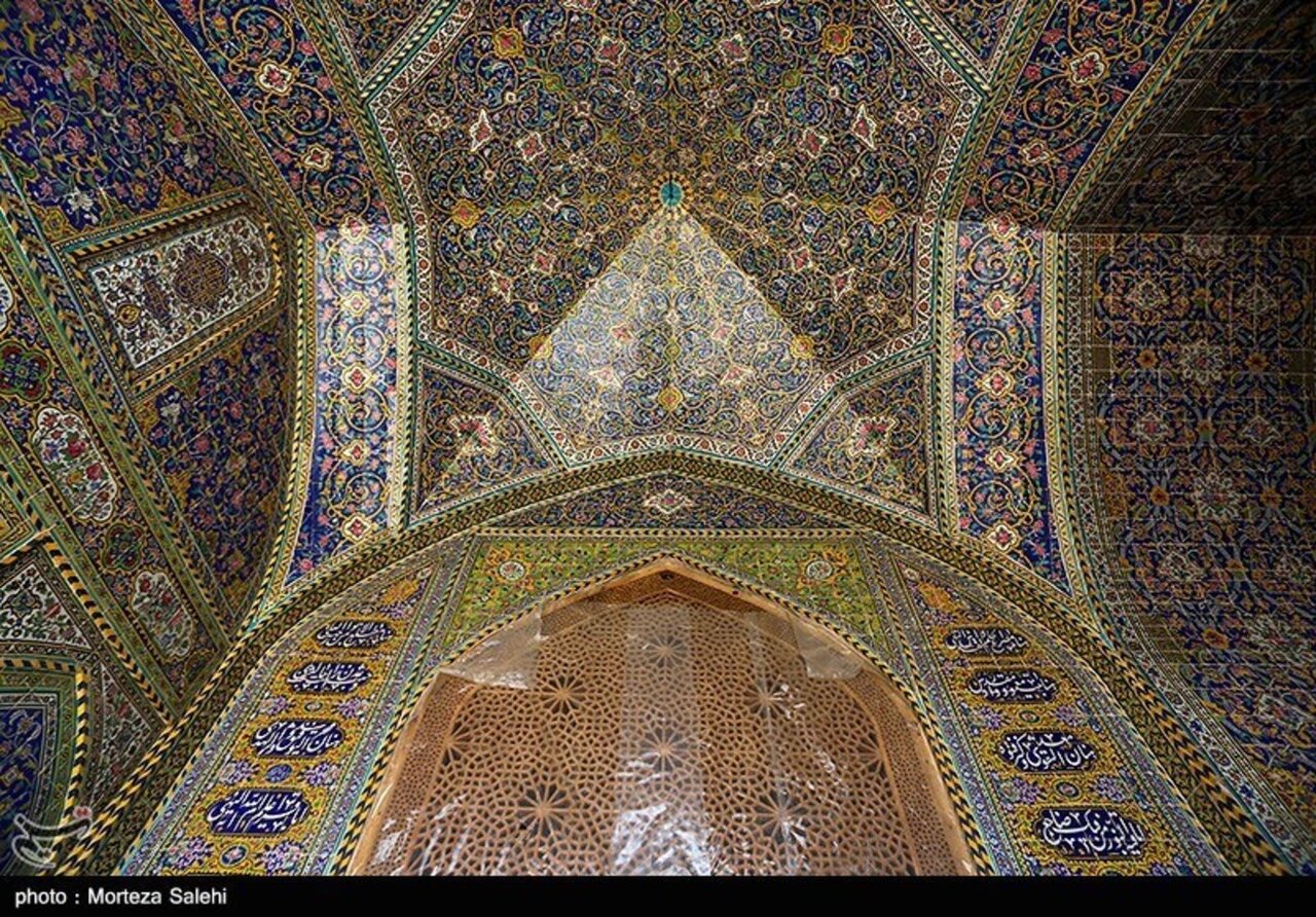 An interior view shows intricate tilework covering the dome and its load-bearing walls of the Seyyed Mosque in Isfahan.