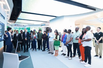 Asian, African, Pacific media visit Huawei exhibition hall in Beijing