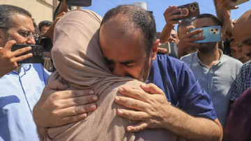 Al-Shifa hospital’s director is welcomed by relatives in southern Gaza after his release from an Israeli prison