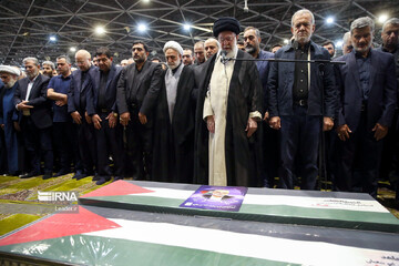 Leader prays over the body of Hamas politcal chief assassinated in an Israeli strike in Tehran on early Wednesday