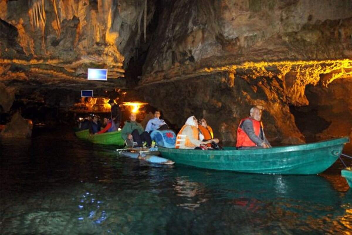 Sightseers on small boats pay visits to Ali-Sadr Cave in Hamedan province.
