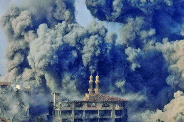 Smoke billows following Israeli strikes on the Islamic University of Gaza (IUG), on October 11, 2023 [Saleh Salem/Reuters]