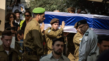 Israeli soldiers carry the casket during the funeral for Israeli soldier Sergeant Yoav Agmon, killed in a Hezbollah drone attack, in Givat Ada on 15 October 2024 (John Wessels/AFP)