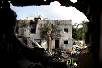 Emergency personnel work at a site of houses damaged following rocket attacks from Lebanon in Kiryat Bialik, Israel, September 22, 2024 [Shir Torem/Reuters]