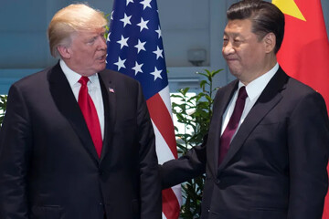 Then-President Donald Trump, left, and China's President Xi Jinping arrive for a meeting on the sidelines of the G20 summit in Hamburg, Germany, on July 8, 2017 [Saul Loeb/Pool via AP Photo]