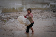 New Year: Gazans face double whammy of Israeli airstrikes and flooding