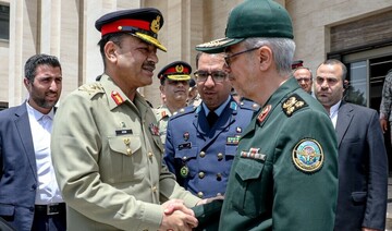 Chief of Staff of the Iranian Armed Forces Major General Mohammad Bagheri (R) shakes hands with a Pakistani general during an Islamabad visit on January 20, 2025.