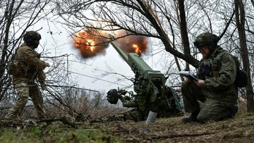 Servicemen fire a howitzer toward Russian troops in Ukraine's Zaporizhzhia region on January 11. Reuters