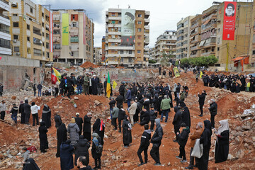 Loyalists gather at the site of the assassination of the Hezbollah leader before his burial ceremony