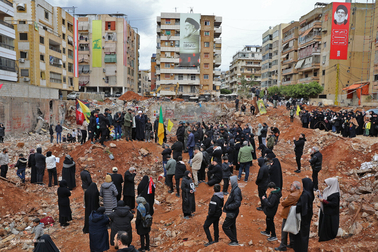 Loyalists gather at the site of the assassination of the Hezbollah leader before his burial ceremony