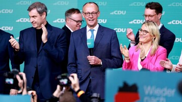 CDU's Friedrich Merz thanks voters as he is greeted with cheers