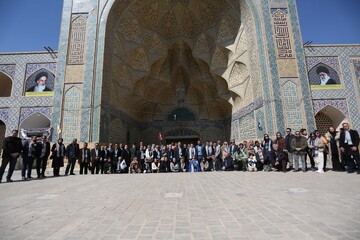 International tour operators pose for a photo at the main courtyard of the UNESCO-registered Jameh Mosque of Isfahan on the first day of a five-day fam tour of the ancient Iranian city, February 19, 2025.