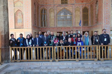 International tour operators pose for a photo during their visit to the 17th-century Ali Qapu palace in the UNESCO-registered Naghsh-e Jahan Square, Isfahan, February 20, 2025.