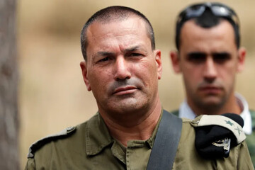 Israeli army Major-General Eyal Zamir, head of the southern command, looks on as he stands near the Israel-Gaza boundary in the southern kibbutz of Nahal Oz [File: Thomas Coex/AFP]