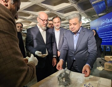 Mostazafan Foundation President Hossein Dehghan (C) and CEO of the Dafineh Museum Group, Hamidreza Soleimani (R) are seen during a ceremony marking the termination of a project for the re-organization, authentication, classification, and documentation of all its artifacts being kept in the museum group on March 15, 2025.