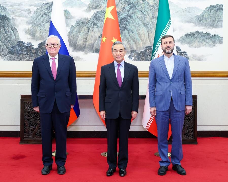 Chinese Foreign Minister Wang Yi meets with Russian Deputy Foreign Minister Ryabkov Sergey Alexeevich and Iranian Deputy Foreign Minister Kazem Gharibabadi in Beijing on March 14, 2025.