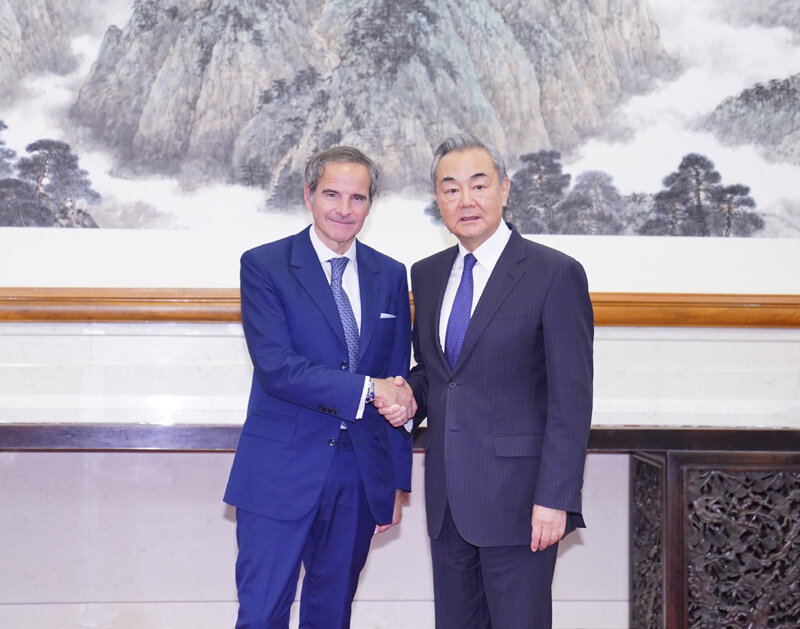 Chinese Foreign Minister Wang Yi meets with IAEA chief Rafael Mariano Grossi in Beijing on April 11, 2025