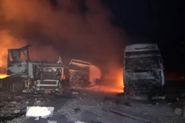 A handout screengrab taken from a video released by Al Masirah TV shows flames and smoke rising from the fuel port of Ras Isa following US air strikes on April 18, 2025