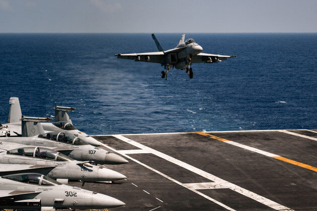 An F18 Hornet fighter jet lands on the USS Harry S. Truman aircraft carrier in the Mediterranean Sea on May 8, 2018. | Aris Messinis/AFP via Getty Images