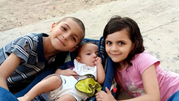 Adam al-Najjar (left), the sole surviving child of the al-Najjar family, pictured with his sisters Sidra (center) and Rival (right), who were both killed in an Israeli airstrike. Courtesy Al Najjar fa