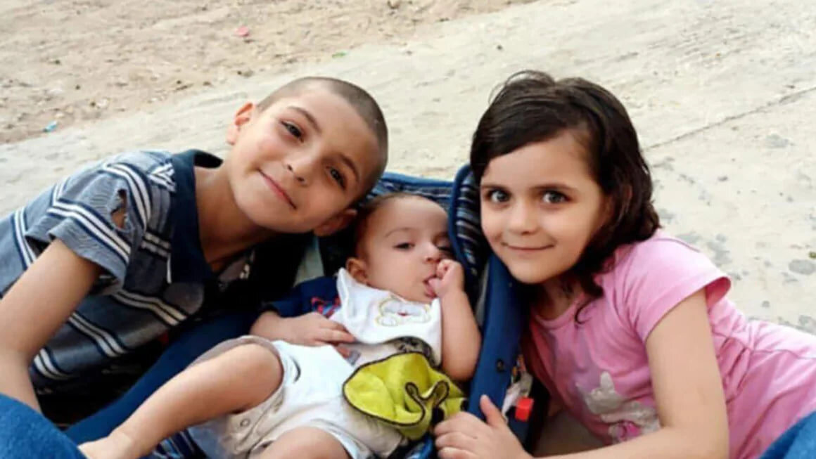 Adam al-Najjar (left), the sole surviving child of the al-Najjar family, pictured with his sisters Sidra (center) and Rival (right), who were both killed in an Israeli airstrike. Courtesy Al Najjar fa