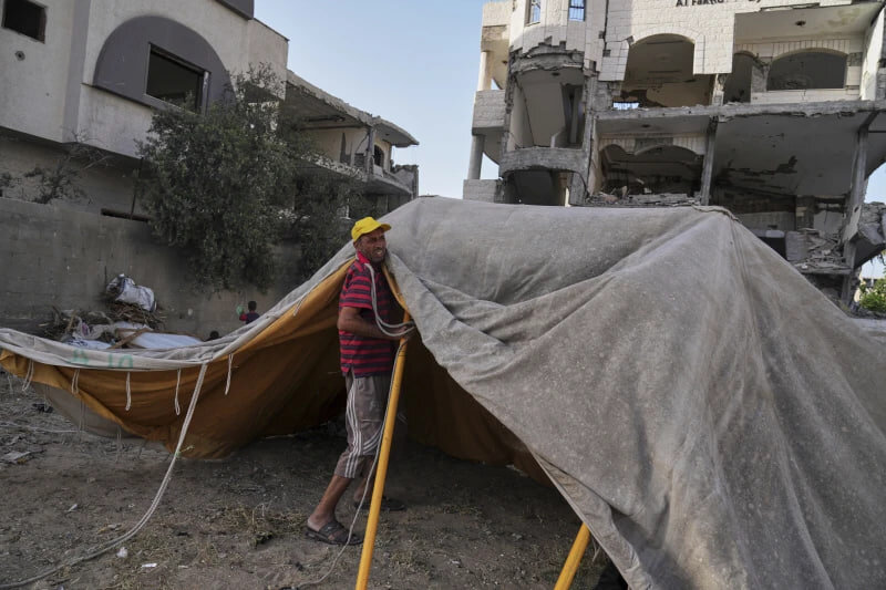 Abu Jarad sets up a new tent for his family after they were displaced by the Israeli air and ground offensive in the Gaza Strip in Gaza City, Monday, May 19, 2025. (AP Photo/Jehad Alshrafi)