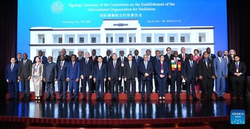 Chinese Foreign Minister Wang Yi participated in a group photo alongside other dignitaries during the signing ceremony for the Convention on the Establishment of the International Organization for Mediation (IOMed) held in Hong Kong Special Administrative Region on May 30, 2025