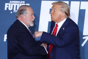Donald Trump and Mike Huckabee shake hands in Drexel Hill, Pennsylvania, on October 29, 2024 [Charly Triballeau/ AFP]