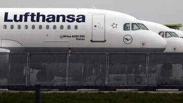 Lufthansa planes are parked at the airport in Munich, southern Germany [File: Matthias Schrader/AP Photo]