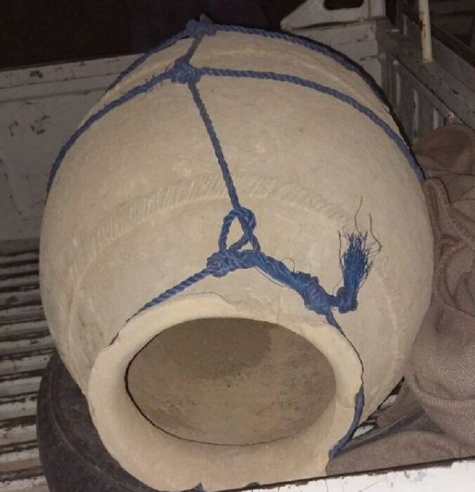 Ancient clay jars unearthed following road erosion in western Iran