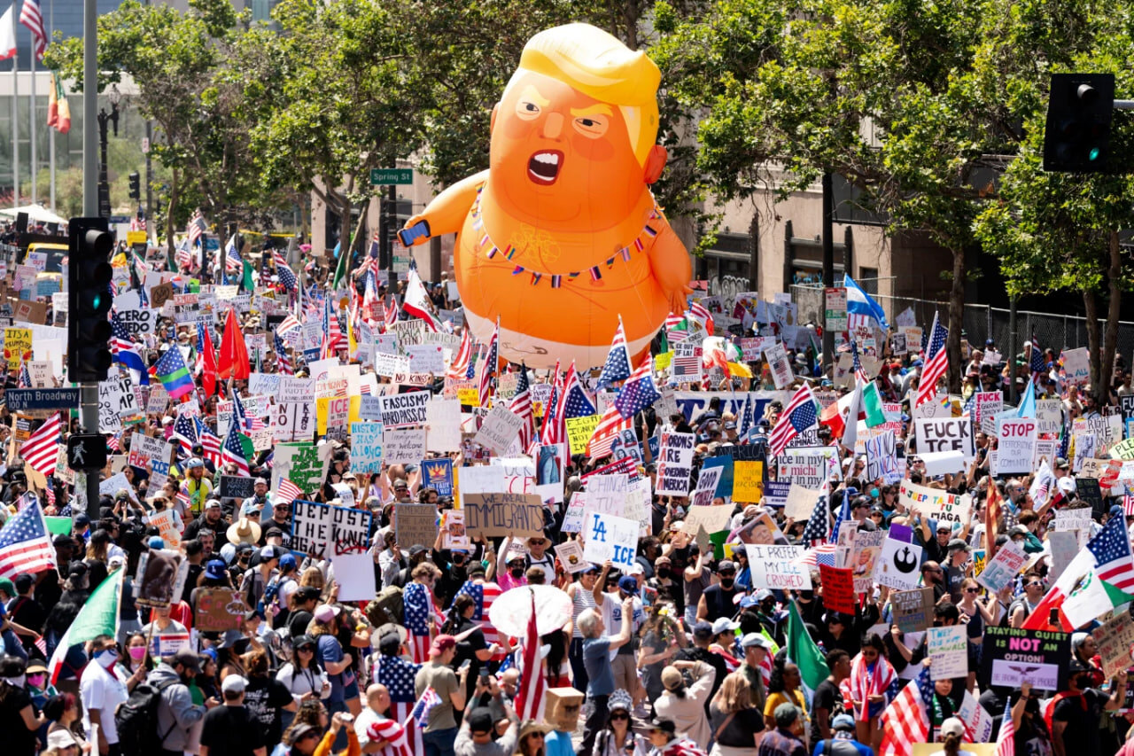 Demonstrators march in the “No Kings” protest with a President Donald Trump balloon in Los Angeles on Saturday, June 14, 2025. (AP Photo/Noah Berger)