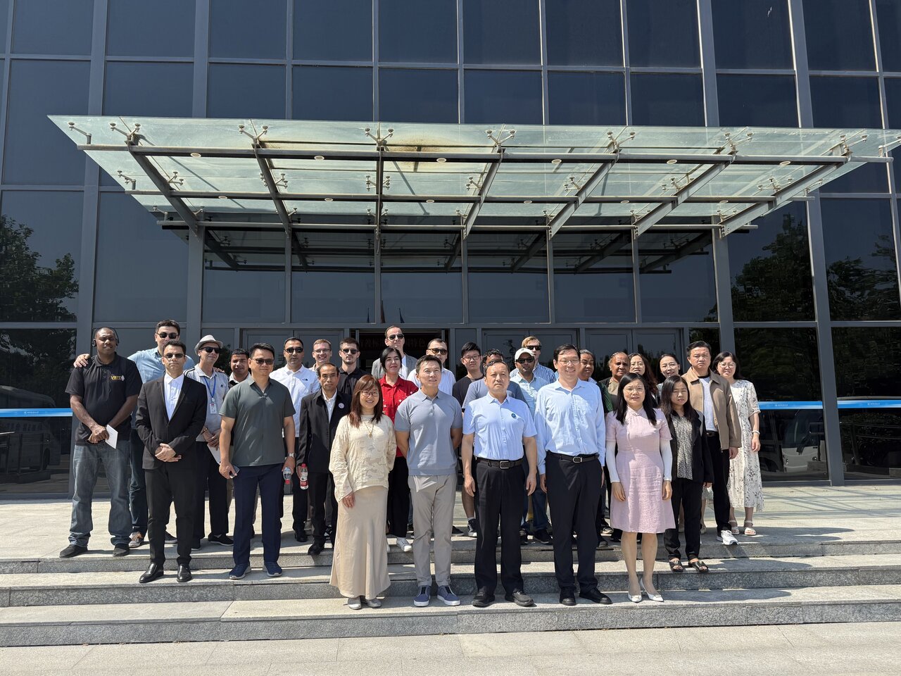 International journalists gather for a group photo at Beijing Polytechnic University in China's capital, Beijing, on June 23, 2025