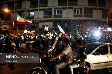 Citizens in Tehran waved national flag after Iran attacked United States' crucial air base in the Persian Gulf region