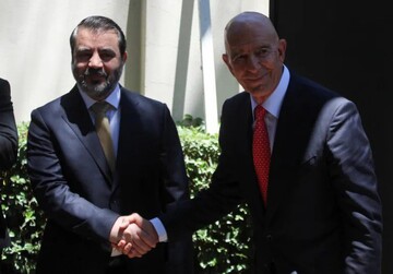 Syrian Foreign Minister Asaad Hassan al-Shaibani shakes hands with U.S. Special Envoy for Syria Thomas Barrack in Damascus, Syria, May 29, 2025 [Firas Makdesi/Reuters]