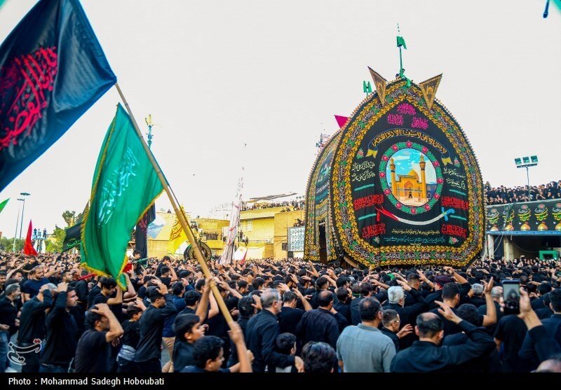Mourners honor the memory of Imam Hussein (AS), the third Shia Imam, during a traditional Nakhl-Bardari ritual in Yazd, central Iran.