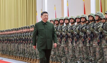 Chinese President Xi Jinping reviews the troops during his inspection of the PLA garrison stationed in the Macao Special Administrative Region, south China, Dec. 20, 2024. (Xinhua/Li Gang)