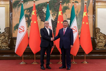 Iran’s President Masoud Pezeshkian shakes hands with Chinese President Xi Jinping in Beijing on September 2, 2025.