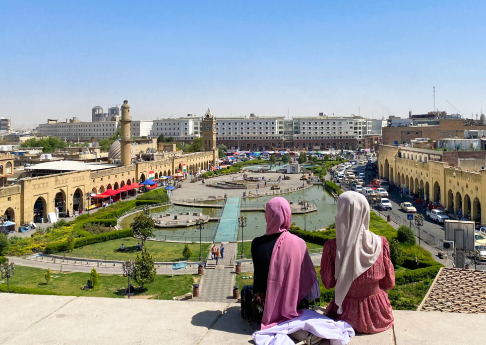 Visitors look at Erbil’s main square from a nearby citadel in Iraq