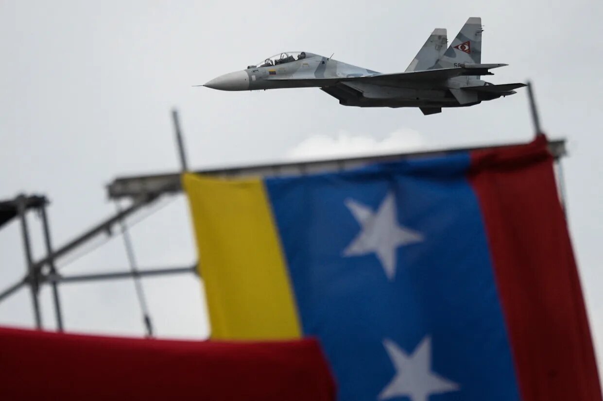 Jet over Venezuelan flag
