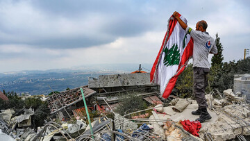Lebanese flag above rubble