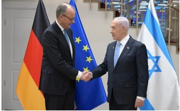 German Chancellor Friedrich Merz (L) and Prime Minister Benjamin Netanyahu shake hands, in Jerusalem, on December 7, 2025. (Amos Ben Gershom/GPO)