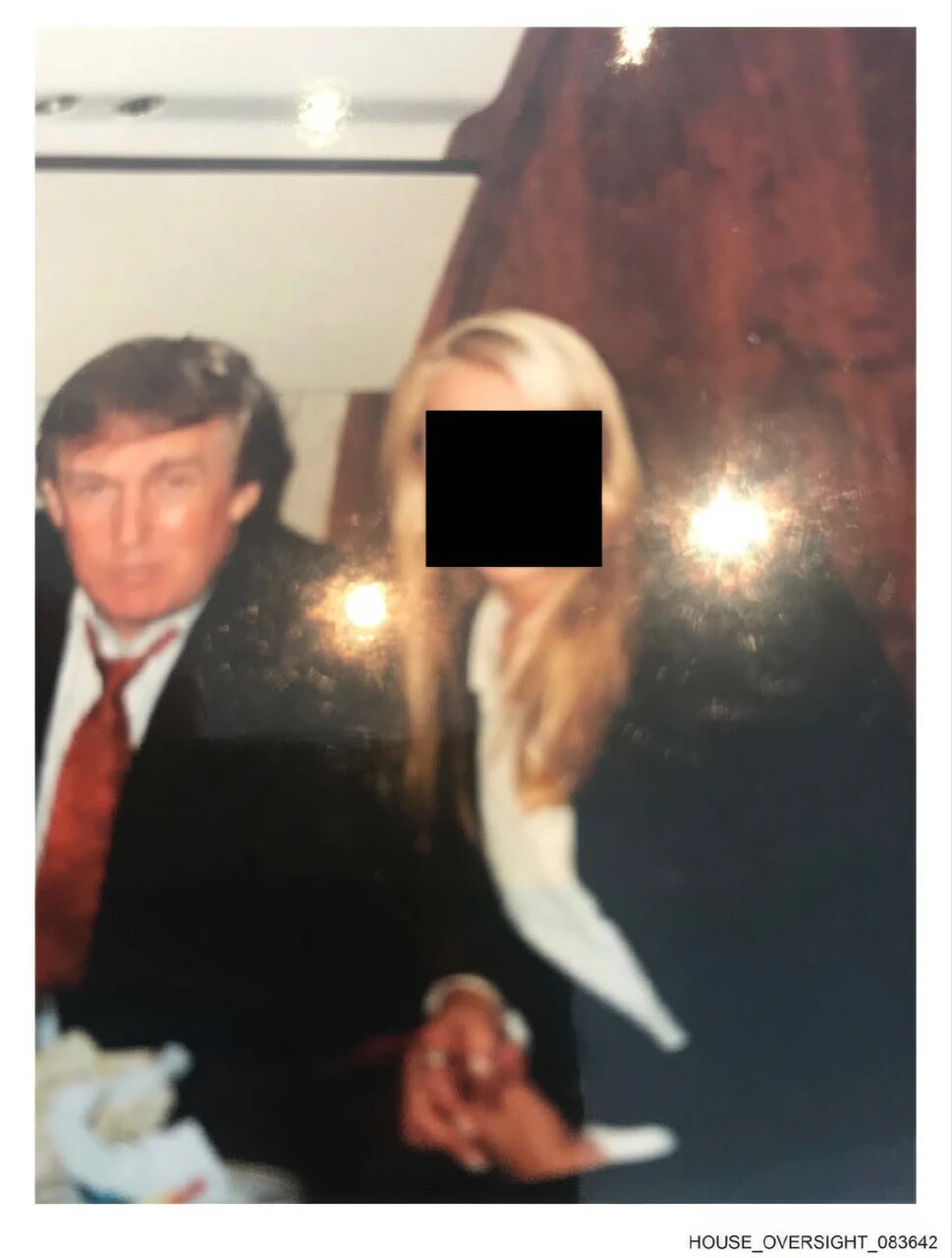 New Epstein estate photos show Trump surrounded by women with blacked-out faces