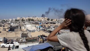 Gazan child watching an airstrike