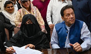 Pakistan's former PM Imran Khan and his wife Bushra Bibi, at an office of Lahore High Court in Pakistan, on July 17, 2023 (AP)