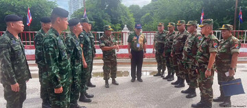 Thai (L) and Cambodian military commanders meeton a bridge at the border (Royal Thai Army/AFP)