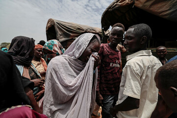 A Sudanese woman from the Darfur region, mourning a relative she said was killed by the RSF (File/Reuters)