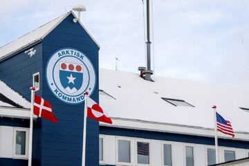 Danish, Greenlandic, and U.S. flags fly at the Danish armed forces' Arctic Command in Nuuk, Greenland, March 2025 (Reuters)