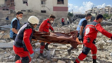 Lebanese first responders are carrying the body of a national killed in Israeli air raids despite the truce