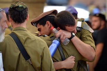 Israeli occupation forces solace each other