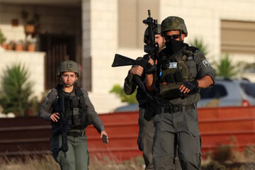 Israeli soldiers in the West Bank village of Sara, near Nablus [Alaa Badarneh/EPA]